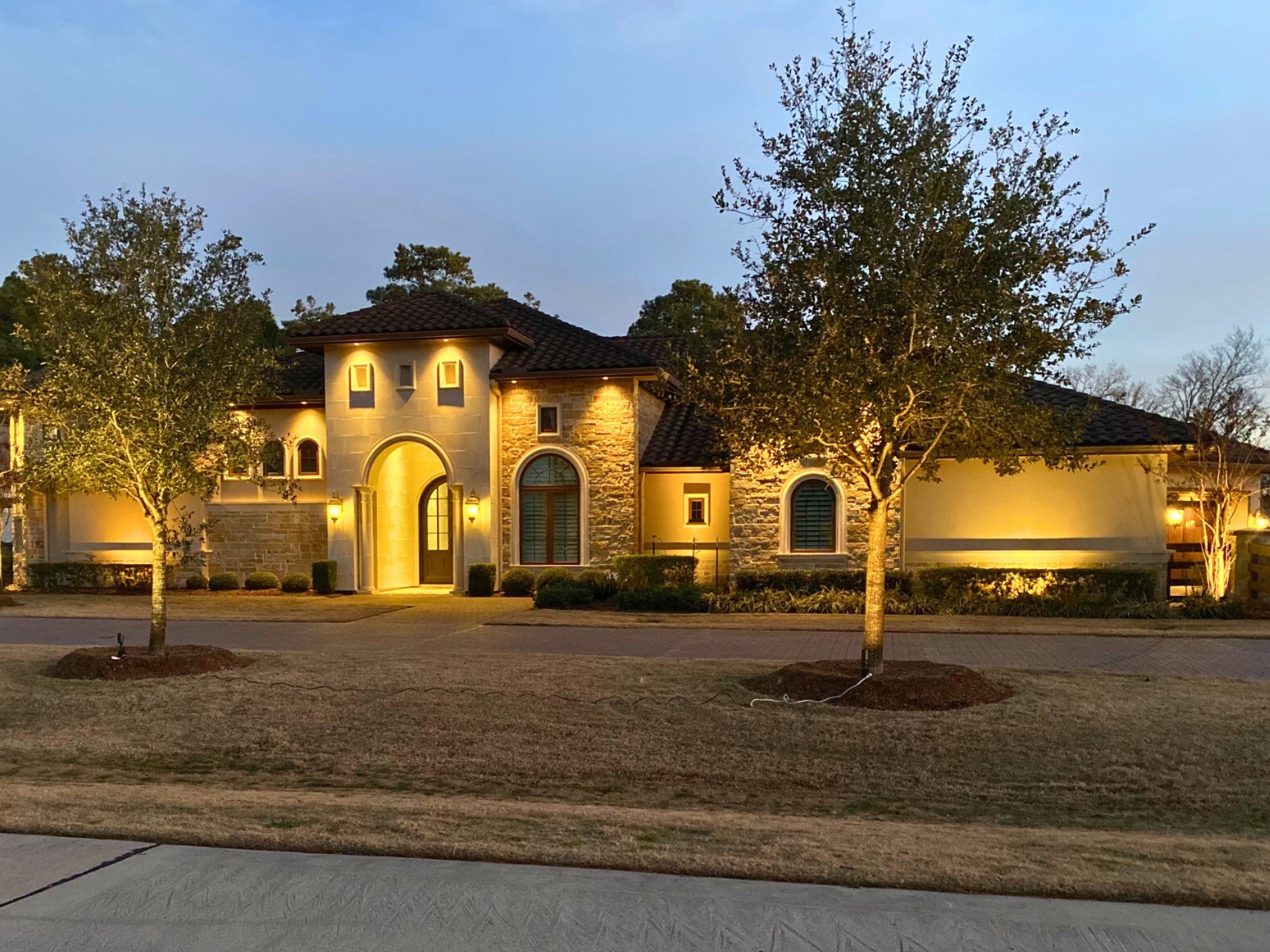 Discover how outdoor lighting can accentuate your home's architectural features, enhancing its allure and charm after dark.